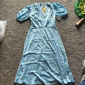 Baby blue midi dress with slit.